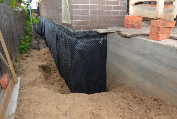 Happy homeowners after waterproofing job in Elba